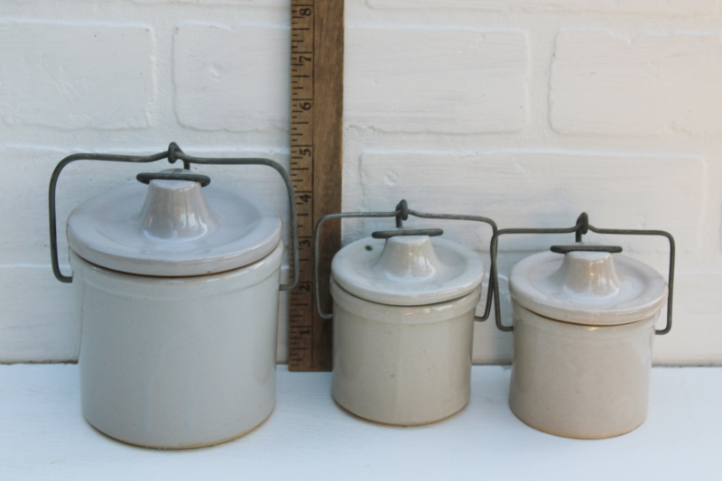 vintage farmhouse decor, old white stoneware crock jars, cheese crocks w/ wire bails and lids