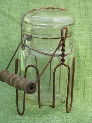 vintage glass bail lid fruit jar in old wirework carrier rack w/ wood handle