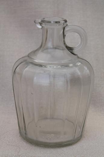 vintage glass bottles, lot of old glass syrup jugs large & small