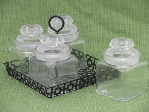 vintage glass canisters or pickle jars in 1950s mod metal carrier rack
