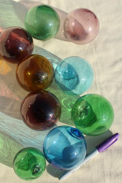 vintage glass fishing net floats, hand blown glass balls, blue green amber amethyst colored glass 