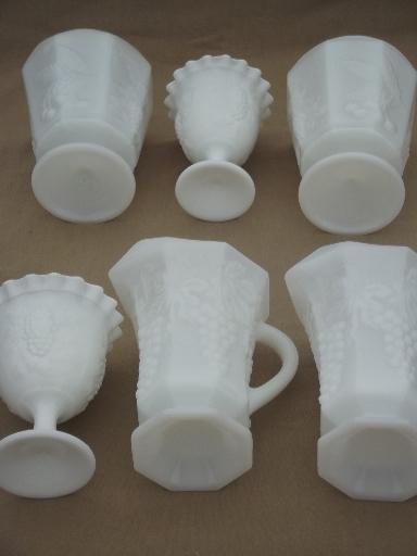 vintage grapes milk glass lot, pitchers, vases in different grape patterns 