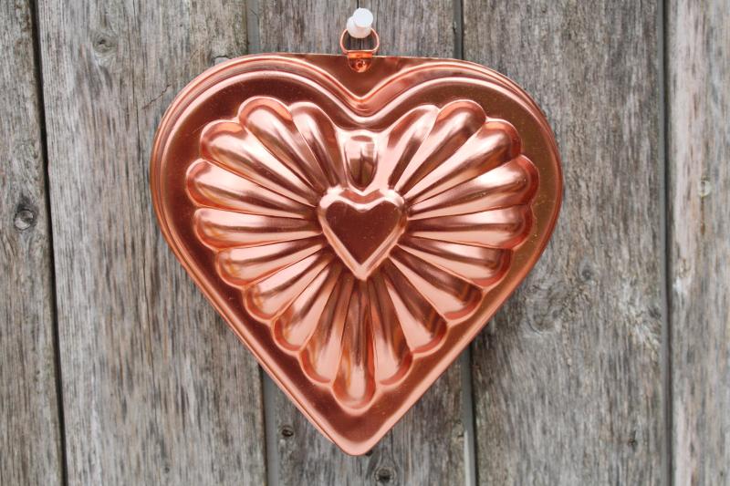 vintage pink copper colored aluminum heart shaped jello mold or cake pan, kitchen wall hanging