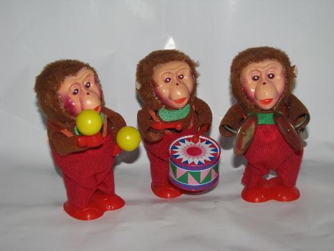 vintage reproduction tin toys, wind-up monkeys musical band