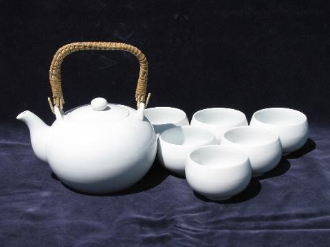 white porcelain oriental tea set, teapot w/ rattan handle, bowl cups
