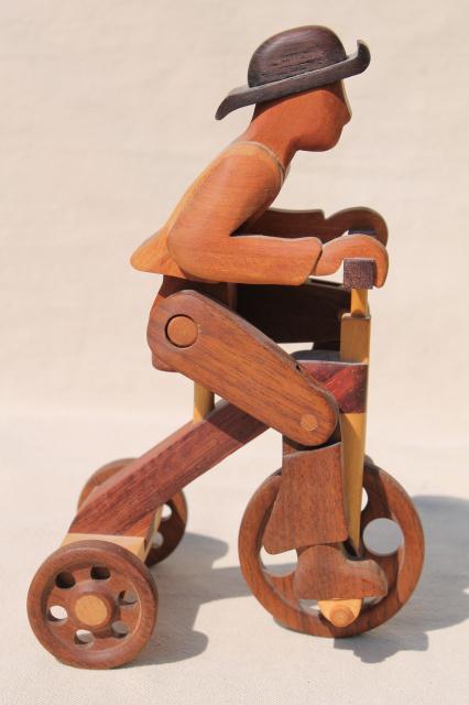 working tricycle wooden toy, handmade wood folk art whimsy, man on wheels