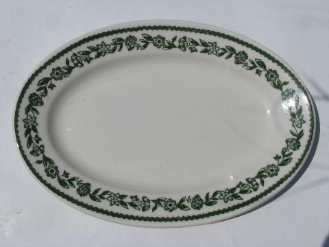 12 white ironstone / green floral border oval plates, vintage Buffalo china