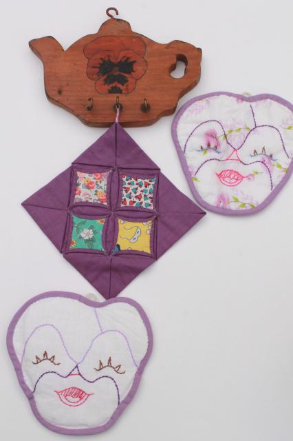 1930s vintage embroidered pansy flower faces potholders on painted pansies wood wall rack