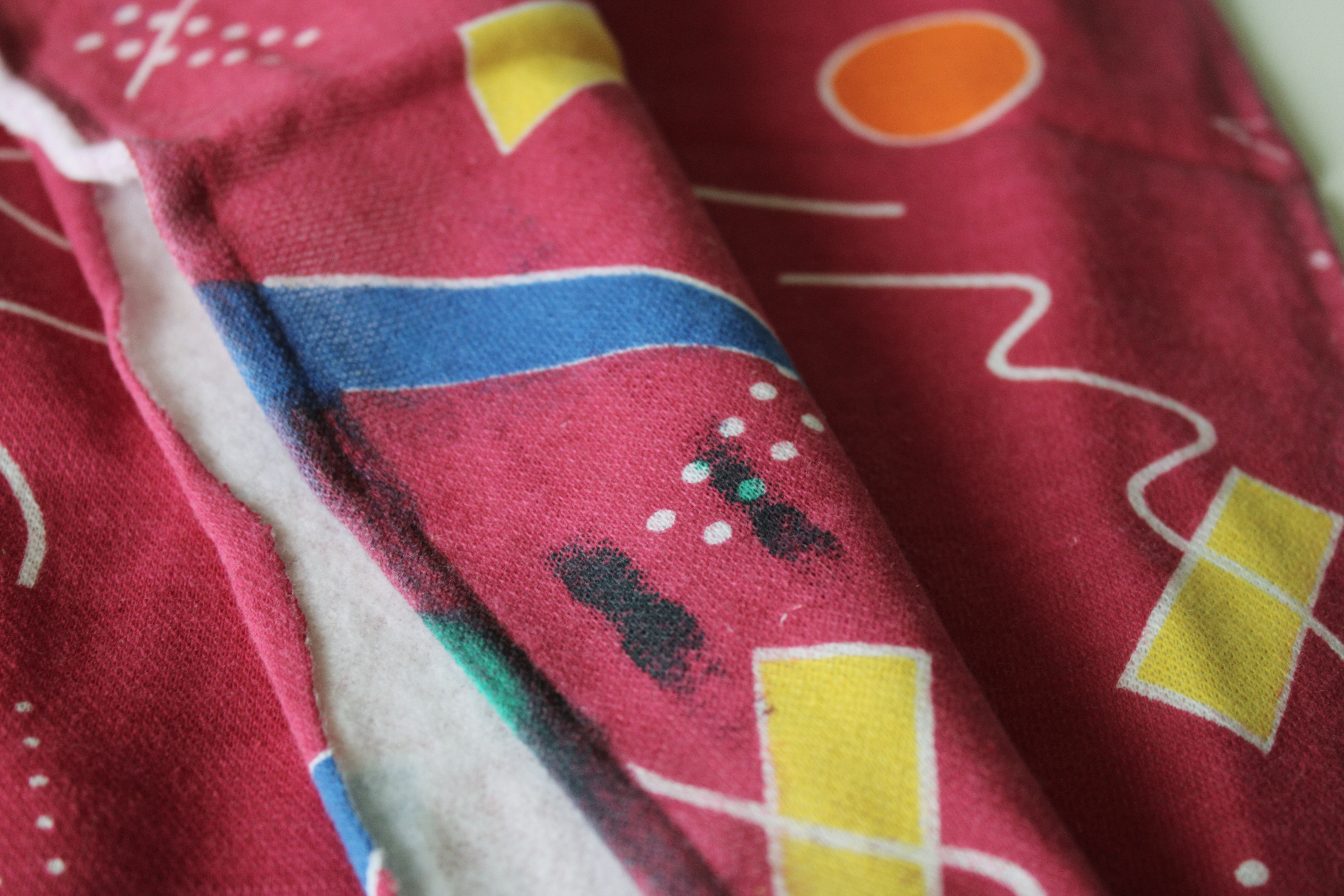 80s 90s vintage sweatshirt fleece knit fabric, colorful retro shapes Memphis design