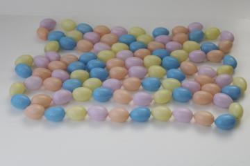 Easter egg garland, plastic mini eggs, retro 90s pastel colors coral lavender blue yellow