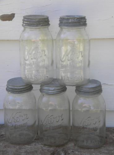 Lot 7 old Kerr 1 qt mason jars w/zinc lids in wire canner basket