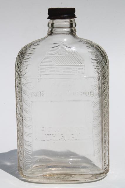 Old Log Cabin Bourbon Whiskey embossed glass bottle, vintage whisky pocket flask 