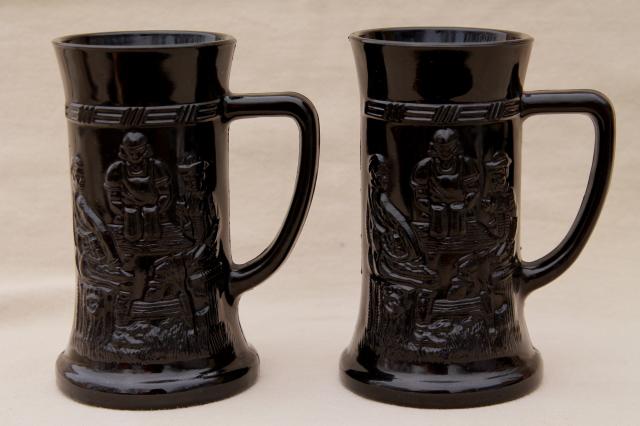 Tiara / Indiana vintage black glass beer steins or mugs w/ tavern drinking scenes
