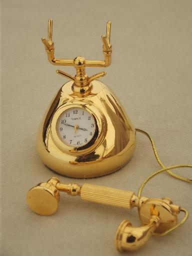 Timex miniature brass clock, old-fashioned phone figural clock, travel clock? 