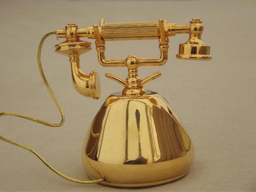 Timex miniature brass clock, old-fashioned phone figural clock, travel clock? 