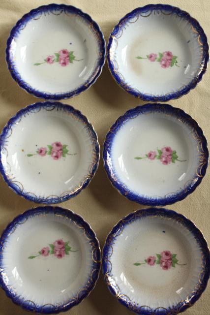 antique Limoges China, flow blue border w/ rose pink floral, American or French?