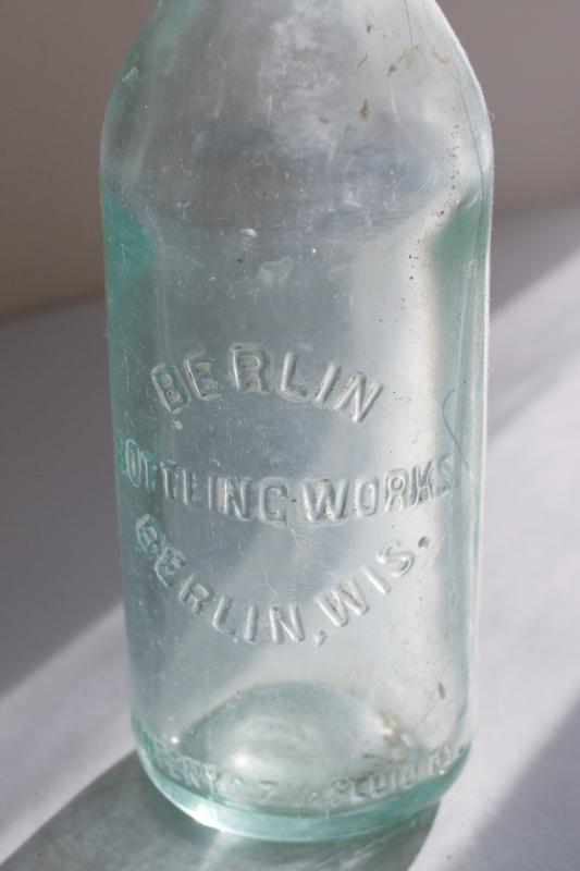 antique embossed glass bottle Berlin Wisconsin Bottling Works, heavy aqua blue glass 