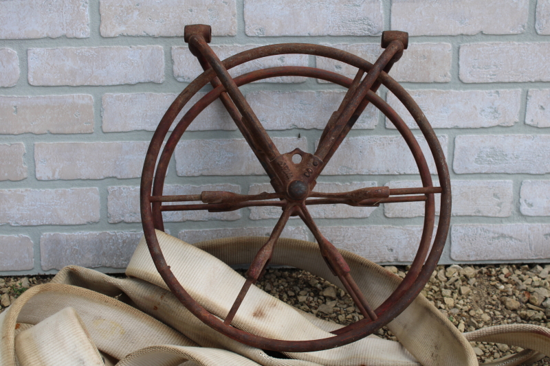 antique fire hose reel, Wirt Knox cast iron wheel and mounting rack w/  Captain cotton rubber fire hose