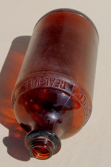 antique vintage amber glass poison bottle, Real Kill embossed quart jar