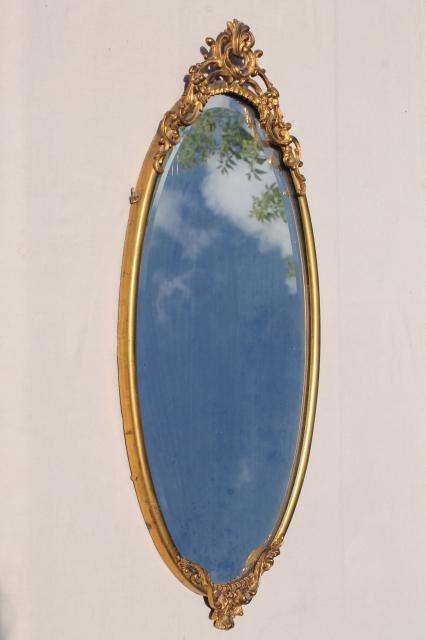 antique vintage beveled glass mirror w/ ornate old gold metal oval frame