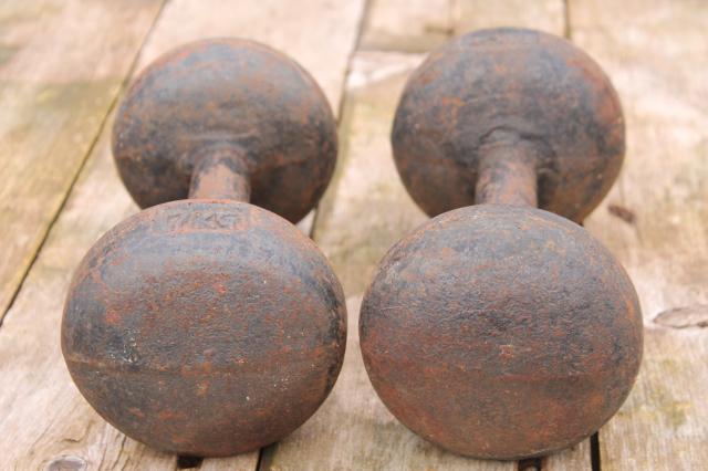 antique weight lifting weights, pair of iron dumbbells, early 1900s vintage sporting equipment