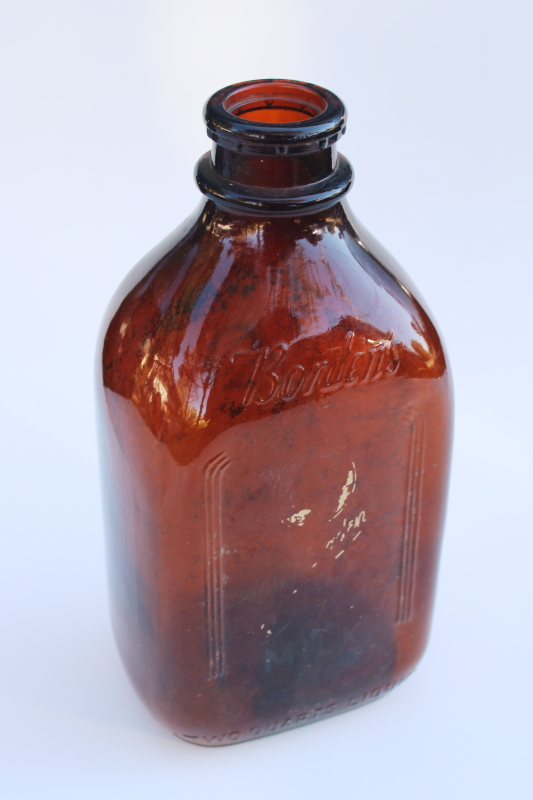authentic old Borden milk bottle, vintage amber brown glass w/ Gail Borden silhouette