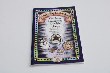 big book of recipes for baking cookies with Brown Bag Cookie molds, cookie stamps