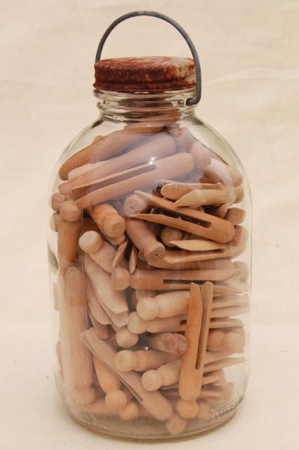big old bail handle glass pickle jar full of vintage wood clothespins