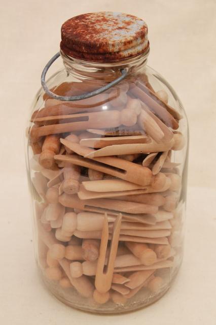 big old bail handle glass pickle jar full of vintage wood clothespins