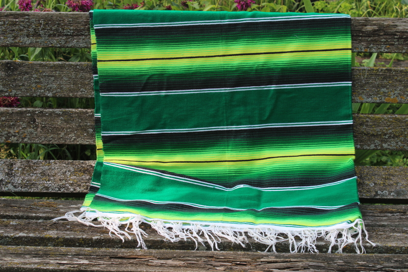 boho style Mexican blanket or rug, serape stripes in bright greens, modern southwest decor