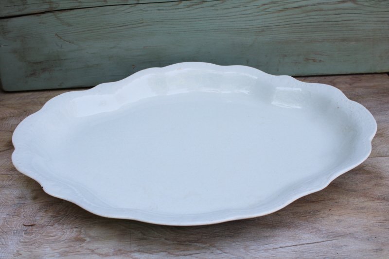 browned old white ironstone china platter, scalloped edge tray w/ embossed border