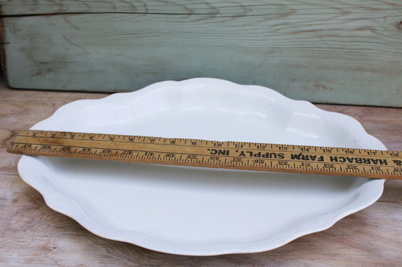 browned old white ironstone china platter, scalloped edge tray w/ embossed border