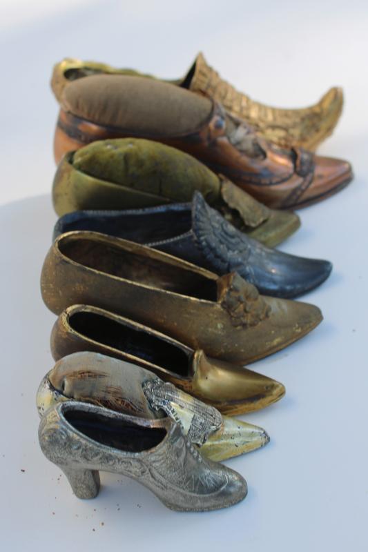 collection of antique vintage cast metal shoes, ladies shoe pincushions
