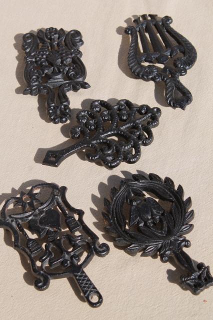 collection of mini trivets, cast iron trivet antique reproductions, vintage Virginia Metalcrafters