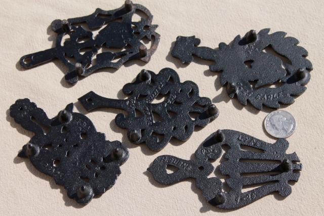 collection of mini trivets, cast iron trivet antique reproductions, vintage Virginia Metalcrafters