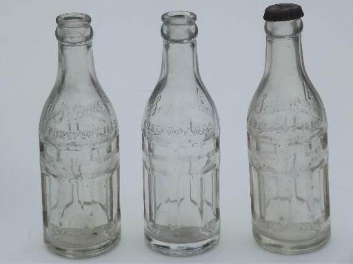 collection of old soda & water bottles, heavy clear glass & aqua blue glass bottles