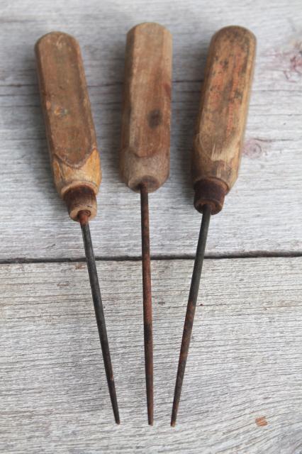 collection of vintage ice picks, primitive worn old wood handled tools