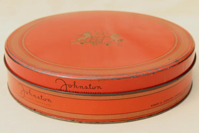 collection of vintage tins in faded colors, coral red, pink, blue