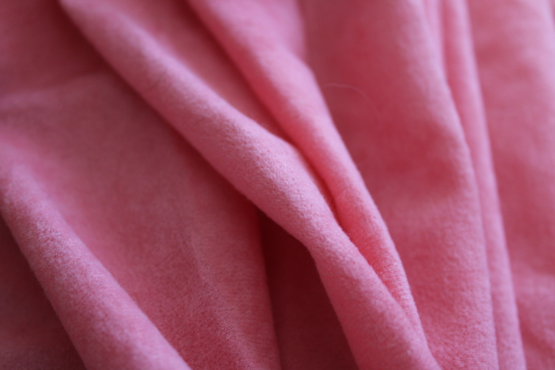 coral pink blush color poly velvet, light synthetic fabric w/ flocked type texture