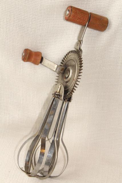 dated 1920s vintage eggbeater, hand crank rotary egg beater w/ primitive old red wooden handle