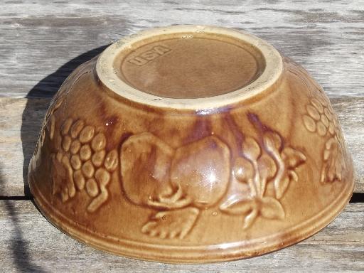 embossed fruit pattern brown stoneware mixing bowl, vintage USA pottery