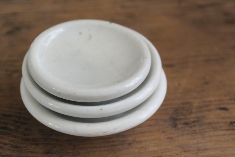 farmhouse vintage butter pats, stack of tiny plates heavy white ironstone china dishes