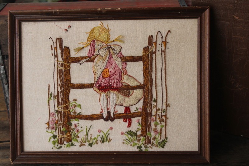 framed crewel embroidery picture on linen, girl w/ braids  pinafore, Holly Hobbie vintage