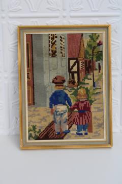 framed vintage needlepoint, old world Dutch or French street scene w/ boy girl