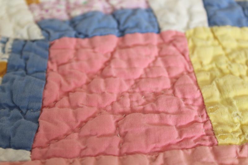 hand-stitched double wedding ring quilt, vintage cotton print fabrics w/ pink border