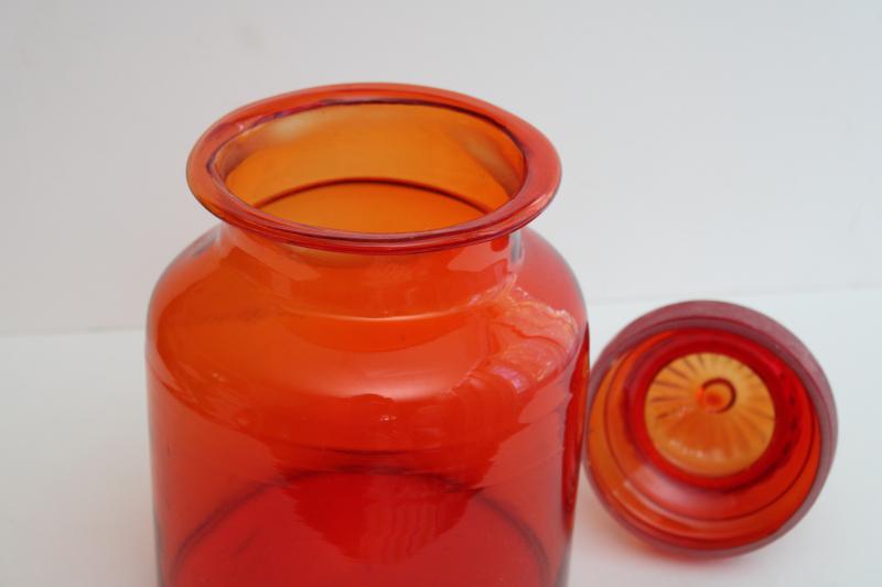 large vintage glass canister or apothecary jar, tangerine orange glass bottle w/ lid