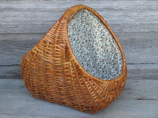 lined rattan or wicker knitting basket, old blue print cotton fabric