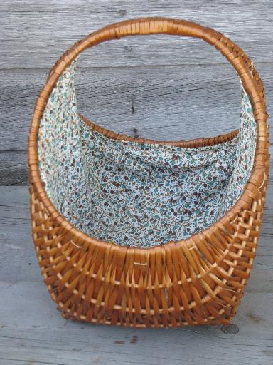 lined rattan or wicker knitting basket, old blue print cotton fabric