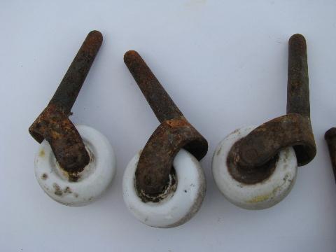 lot of antique furniture casters with white ironstone porcelain wheels