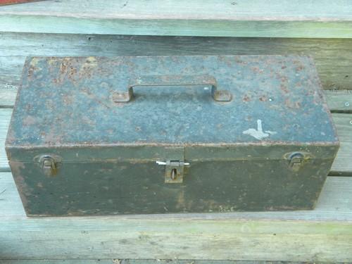 lot of vintage metal tool and storage boxes with shabby old paint
